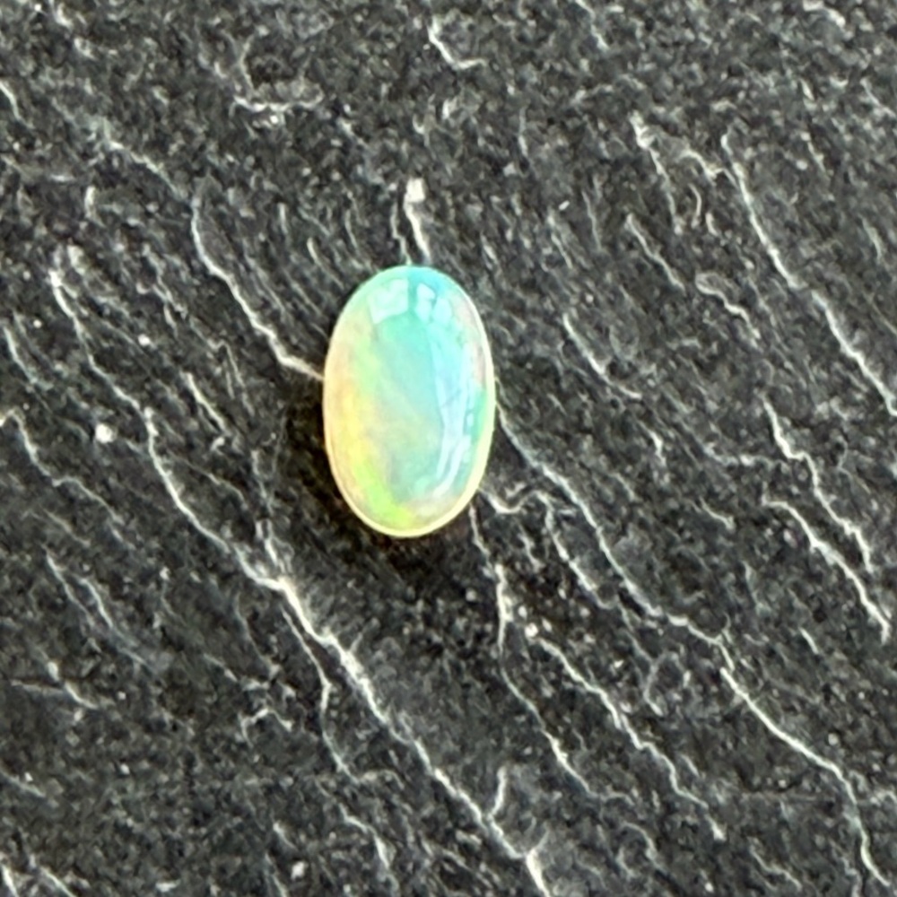 Ethiopian Opal Oval loose 9x6 Gemstone .77 carats